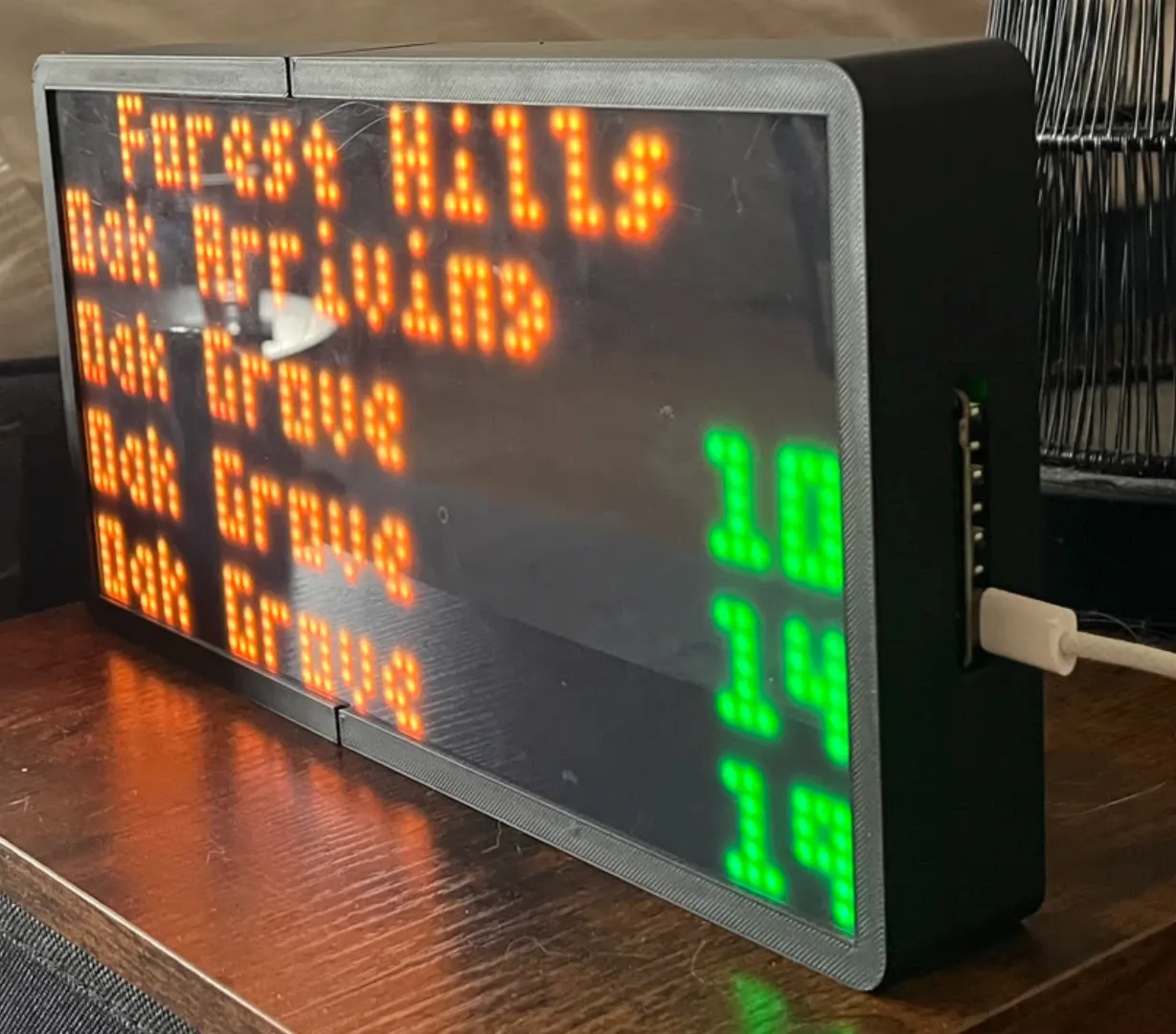 The My Stop departure sign in its 3D-printed case, showing Forest Hills departures